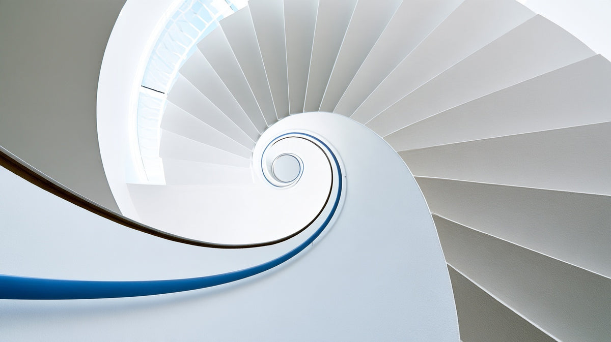 White spiral staircase with a blue handrail.